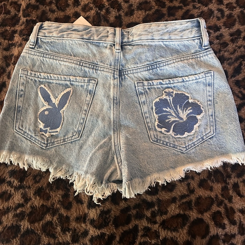 PLAYBOY Blue Jean Shorts with Distressed Hem and Unique Back Designs